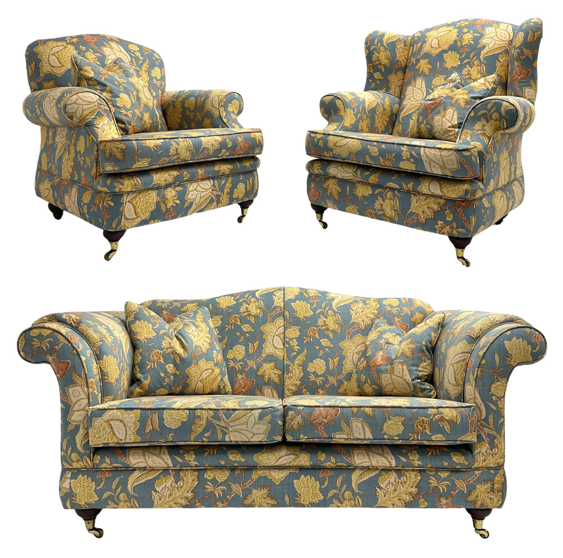 Lincoln House - two seat sofa (W170cm), wingback armchair (W94cm), and armchair (W90cm), upholstered in blue ground fabric with floral pattern