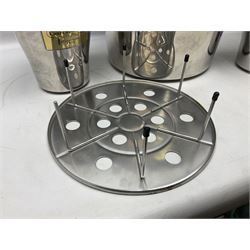 Stainless steel Laurent-Perrier champagne bucket, with engraved brass plaque and grip to swing handle, together with three matching smaller, largest D38cm (4)