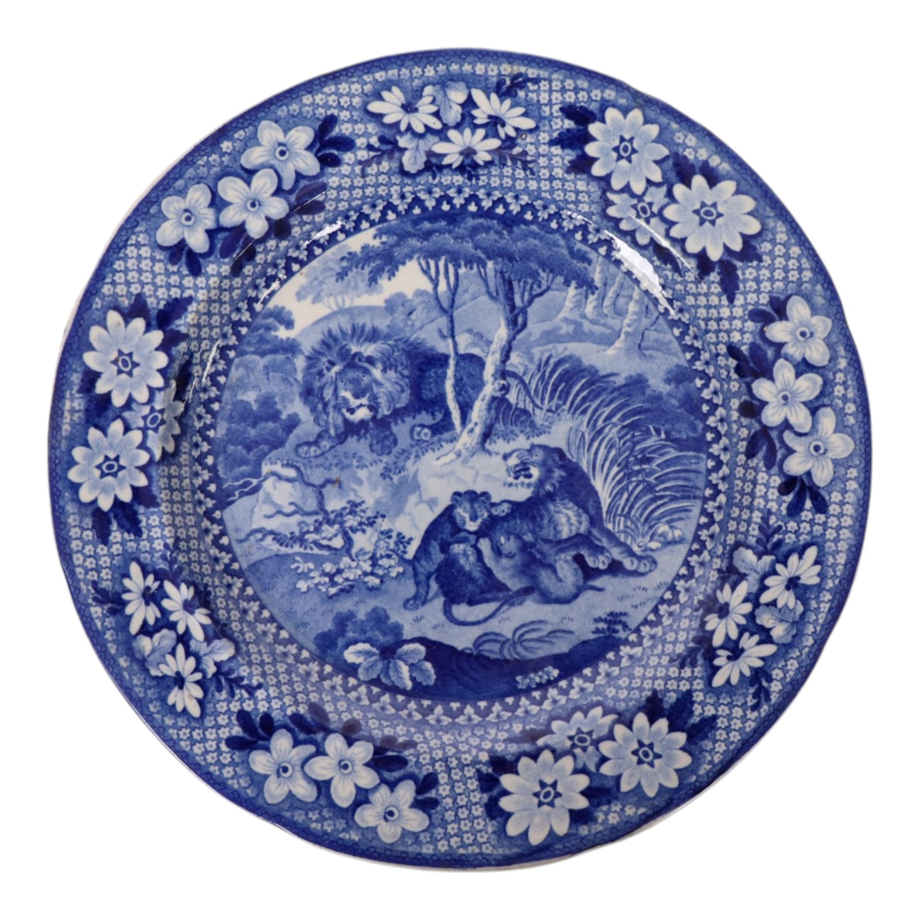 Early 19th Century Spode Caramanian series serving dish, printed in blue and white with the Triumphal Arch at Tripoli in Barbary, reserved within a running border of Indian sporting animals, together with Rogers Camel pattern platter and plate, Adams Lions plate and Davenport platter, largest platter L43cm 