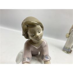 Three Lladro figures, comprising Garden Classic, signed no 7617, Summer Stroll no 7611 and Best Friend no 7620, all with original boxes, largest example H24cm 