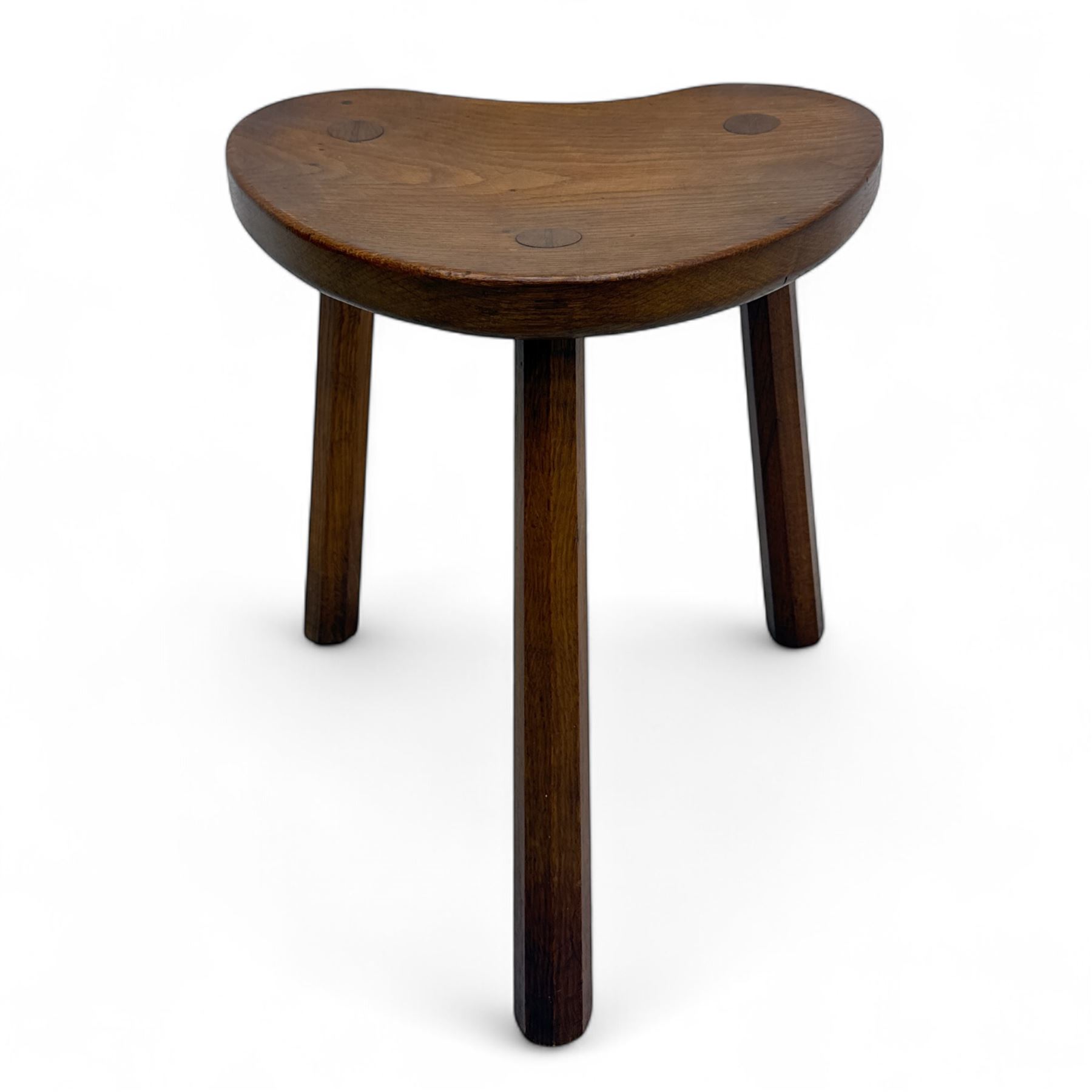 Mouseman - oak three-legged cow stool, kidney-shaped seat carved with the signature mouse motif, by the workshop of Robert Thompson, Kilburn