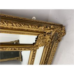 Gilt Rococo style mirror, arched top with central cartouche and oak leaf moulded pediment, floral and fruit moulded surround with segmented glass panels, bevelled central pane, c-scroll shell and acanthus leaf brackets