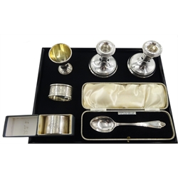 Pair silver dwarf candlesticks by 	A Chick & Sons Ltd, Birmingham 1975, two silver napkin rings, silver christening spoon cased and a silver egg cup, all hallmarked, weighable silver 3.2oz