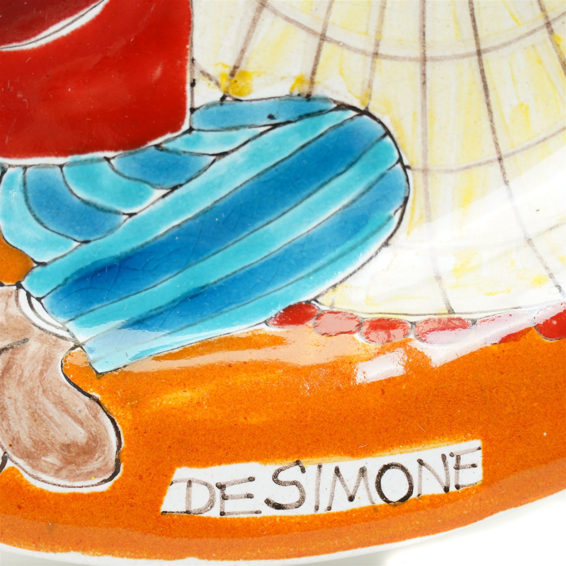 Giovanni DeSimone - two hand-painted mid-century plates, each incised and polychrome enamelled, signed to the front , larger plate D25cm