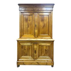 19th century French walnut dresser, the moulded cornice over two-panelled cupboard doors, enclosing two shelves and one small
drawer, on a base of two further cupboards