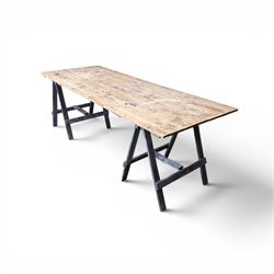 Vintage wooden plank trestle table, on two painted folding stands