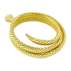 18ct gold coiled diamond snake bangle, the head set with round cut diamonds and emerald eyes, to an expanding articulated body, stamped Brevete S.G.D.G.