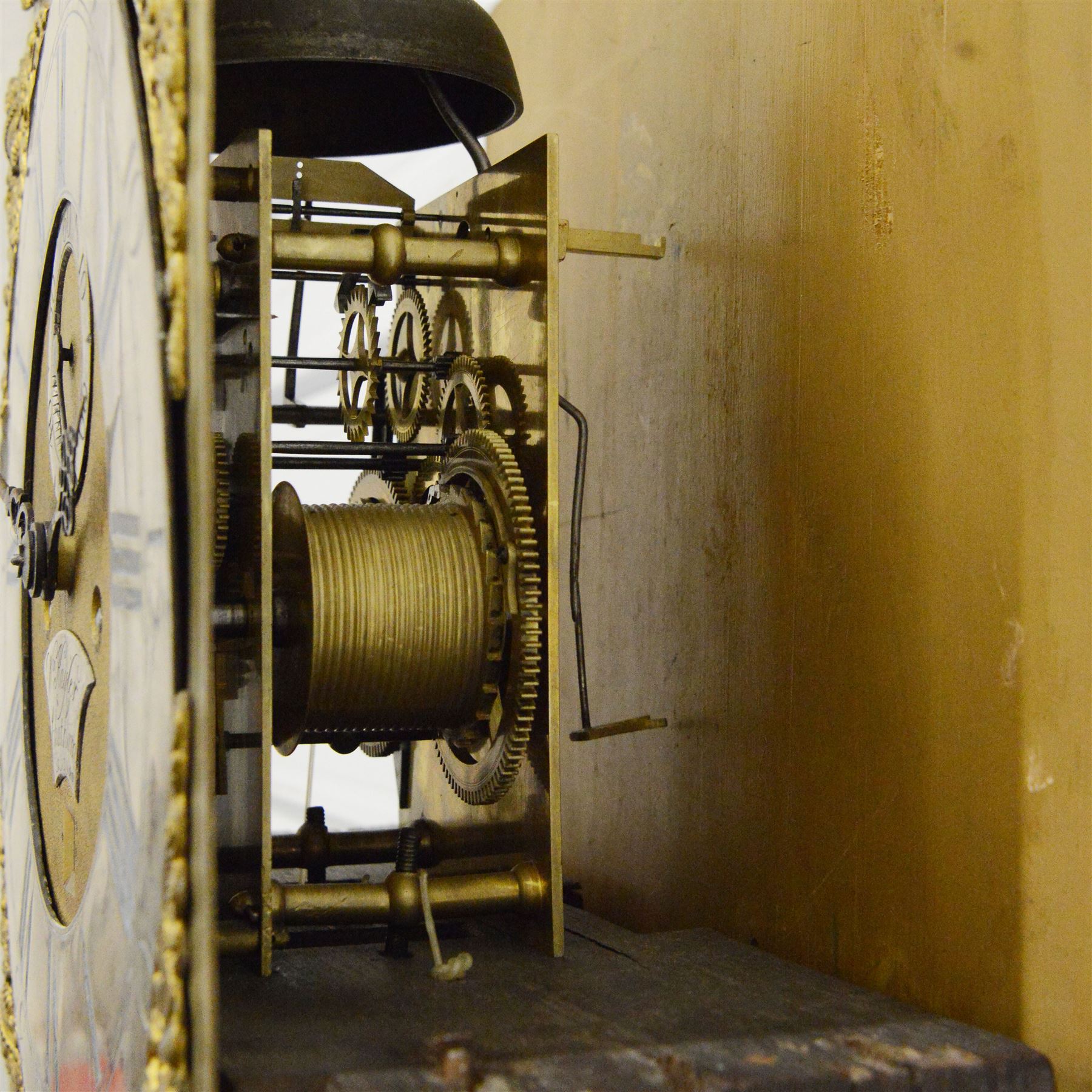 William Hayler of Chatham (Kent) - Fine George III black japanned chinoiserie decorated longcase clock c1760,  hood with a break arch top, glazed side panels and three matching wooden finials, conforming hood door beneath with attached pilasters, long trunk with a  break arch door and moulded surround, on a square double stepped plinth with a flat base, case and hood profusely decorated with scenes of gilt pagodas, temples, birds, people and panels of floral decoration, brass dial with cast brass spandrels and a silvered boss to the arch, silvered chapter with Roman numerals, minute track and five minute Arabic's, matted dial centre with seconds dial, date aperture, matching steel hands and silvered cartouche with makers name, dial pinned directly to a five-pillar rack striking movement with a recoil anchor escapement. With  pendulum, weights  and key.
William Hayler is recorded as working in High Street, Chatham, from 1750-1810, possibly two makers (father & son) working in succession.

