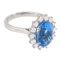 18ct white gold oval cut Swiss blue topaz and round brilliant cut diamond cluster ring, hallmarked