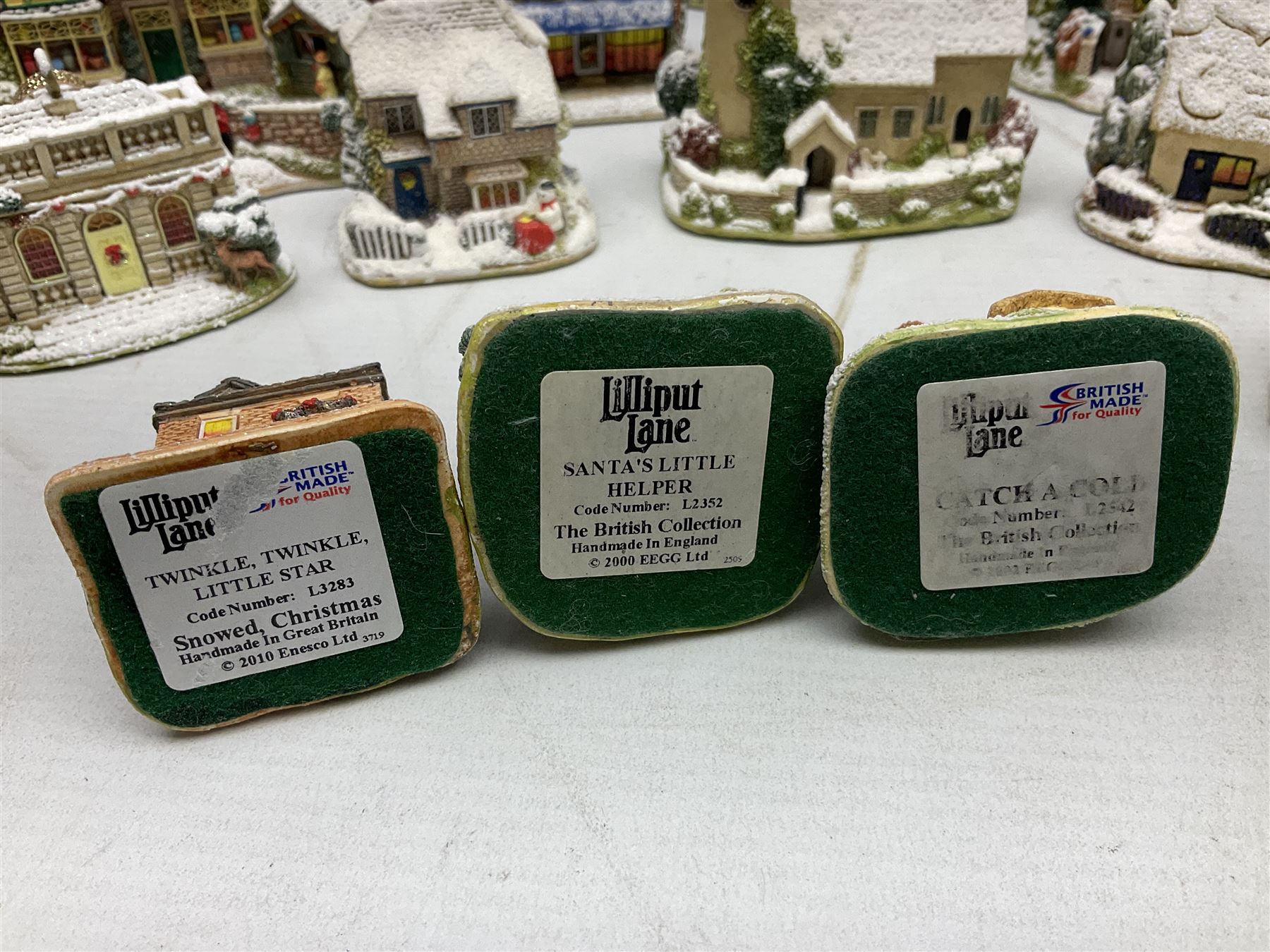 Five Lilliput Lane Illuminated Cottages, comprising Christmas is Coming, with box and deed, Christmas at Mol's, with box and deed, Christmas in Canterbury, with box and deed, Christmas Lights at Sweet Delights and The Three Kings, with box and deeds, together with twelve other Lilliput lanes, to include The First Noel, with box and deed, Winters Moonlight, Yuletide treats, with box and deed etc (17)