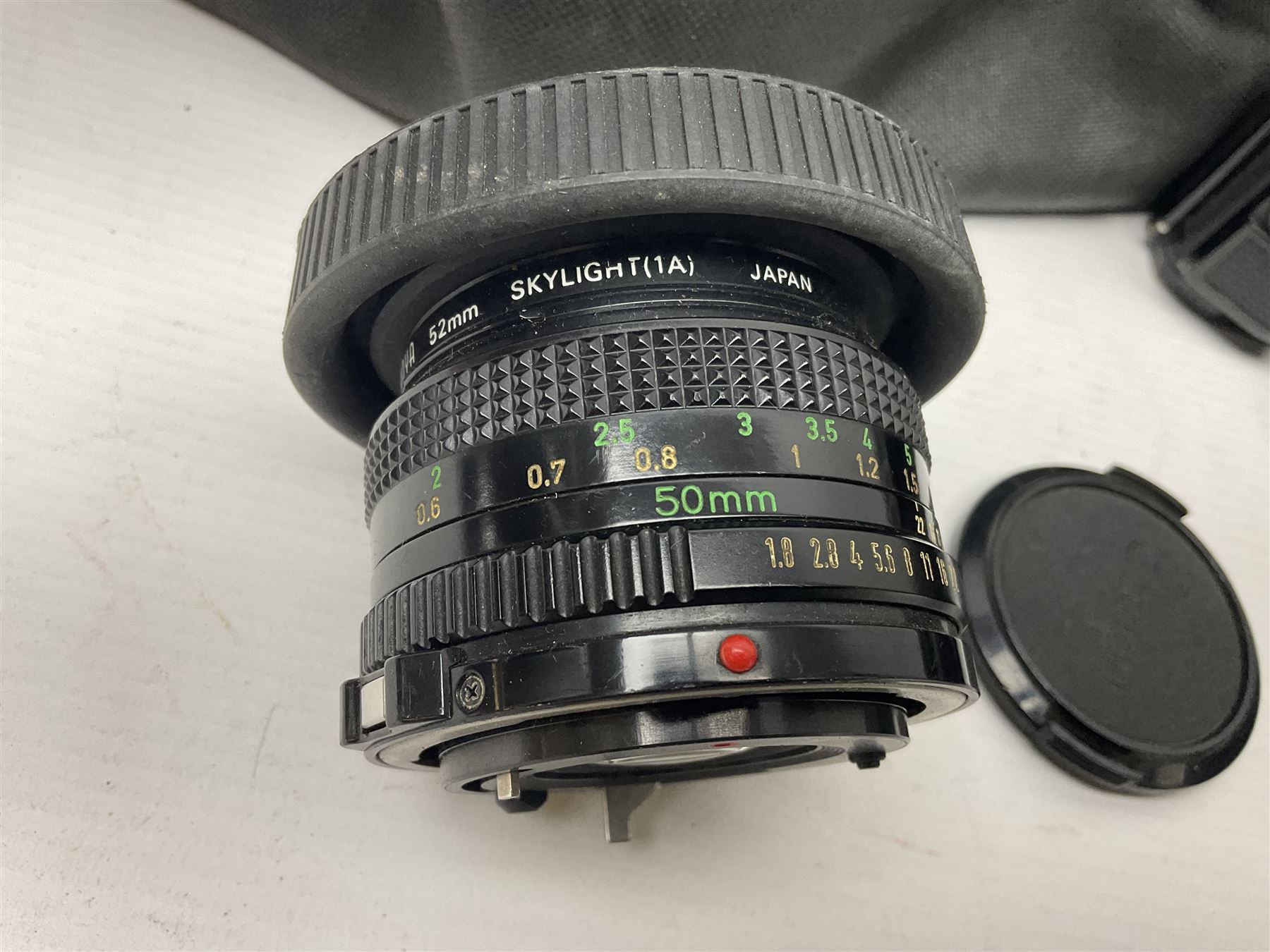 Canon A1 camera body, serial no 775843, together with 'Canon Lens FD 200mm 1:4 lens' serial no 24432, together with Semi Minolta folding camera, Canon 'Zoom FD 35-105mm 1:3.5-4.5' lens, Canon 'Macro Focusing Zoom 72mm Hanimex HMC 28-200mm' lens and other camera equipment  