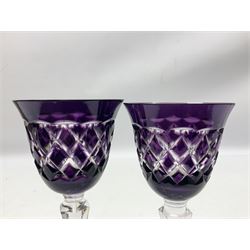 Twelve bohemian style wine glasses, the purple bell form bowls with flared rims and cut diamond pattern decoration raised upon tapering hexagonal stems and star cut base, H19cm