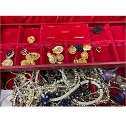 Costume jewellery beads, earrings etc, along with two jewellery boxes. 