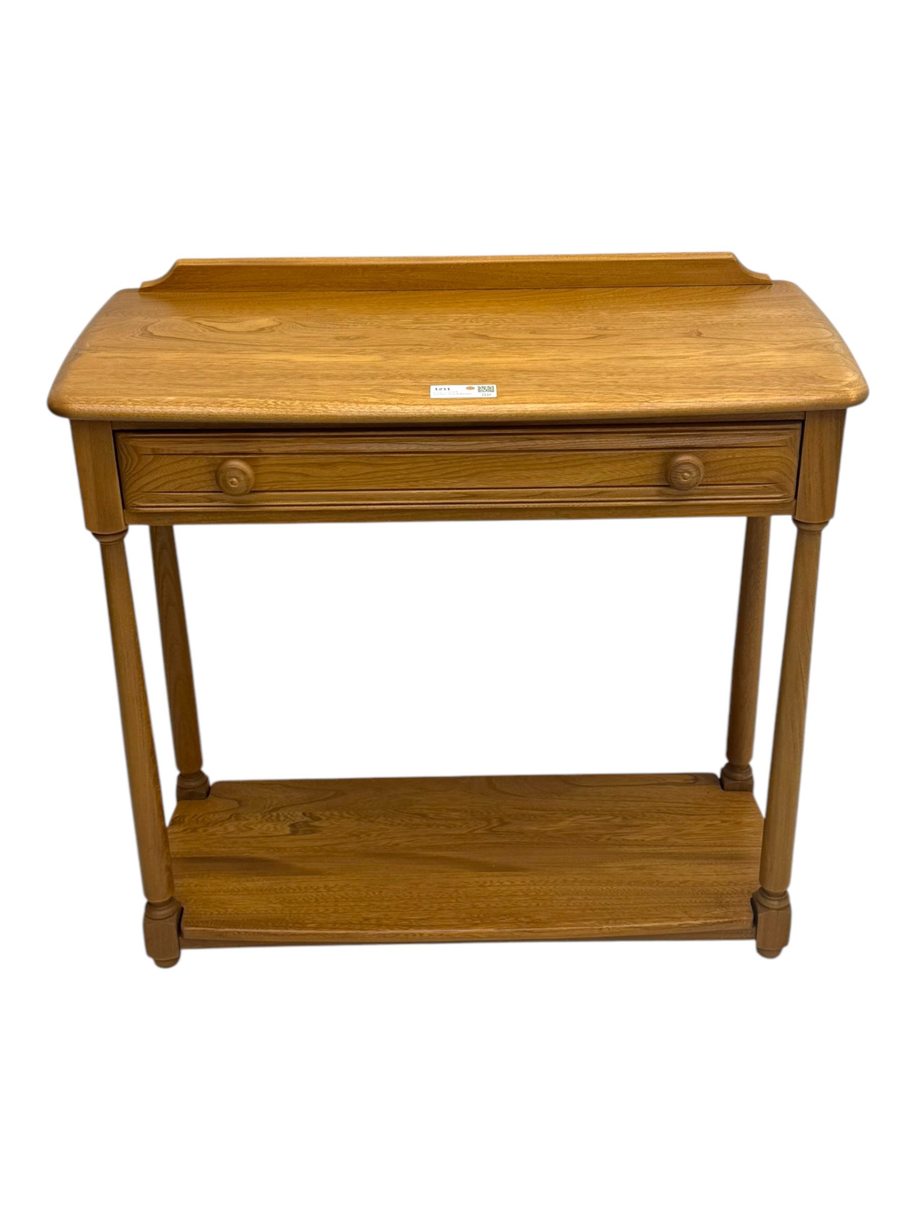 Lucian Ercolani for Ercol - mid 20th century light elm console table, rectangular top with raised gallery back over full-width frieze drawers, raised on tapered supports united by undertier 