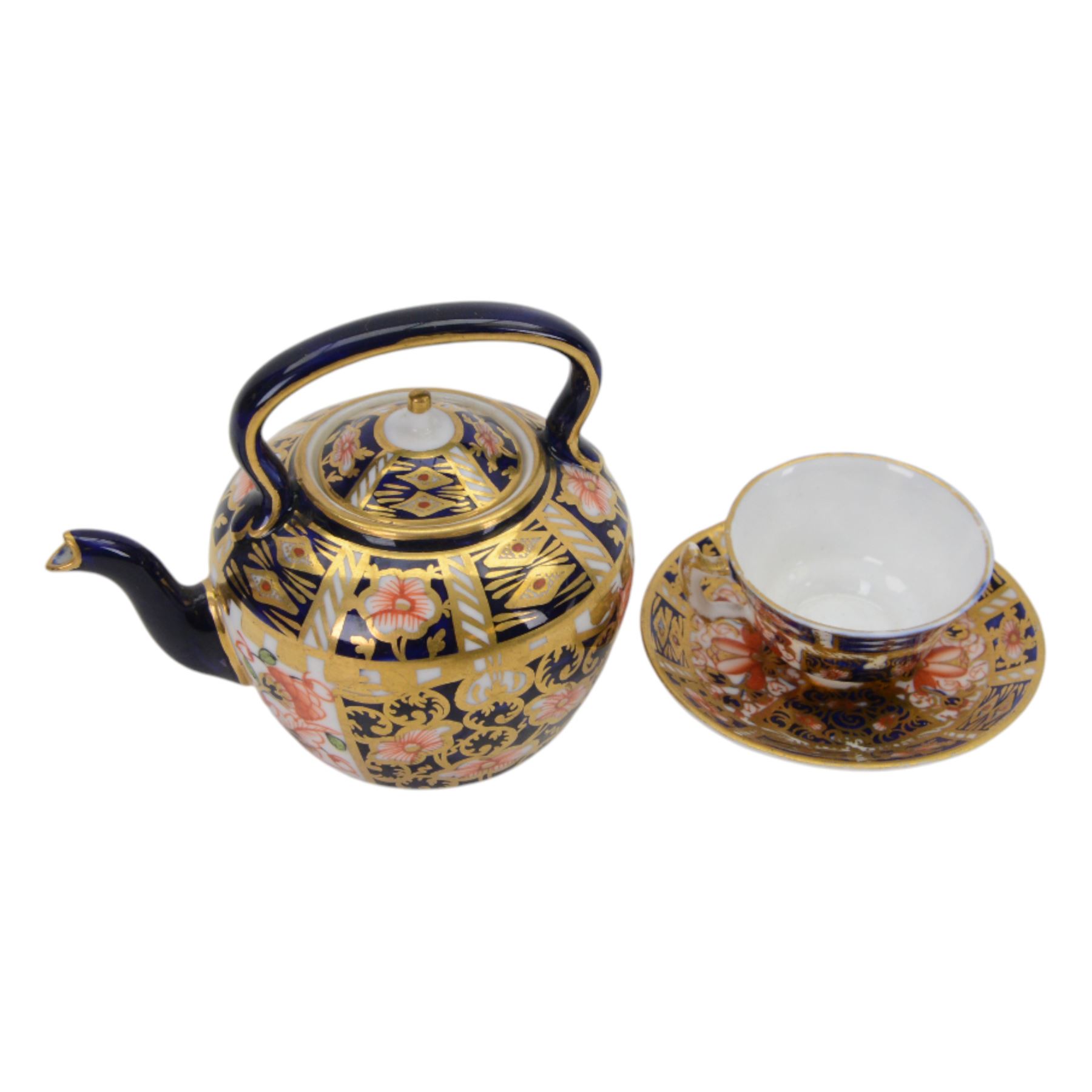 Royal Crown Derby imari pattern, miniature teapot and teacup, together with two cups and saucers and three plates