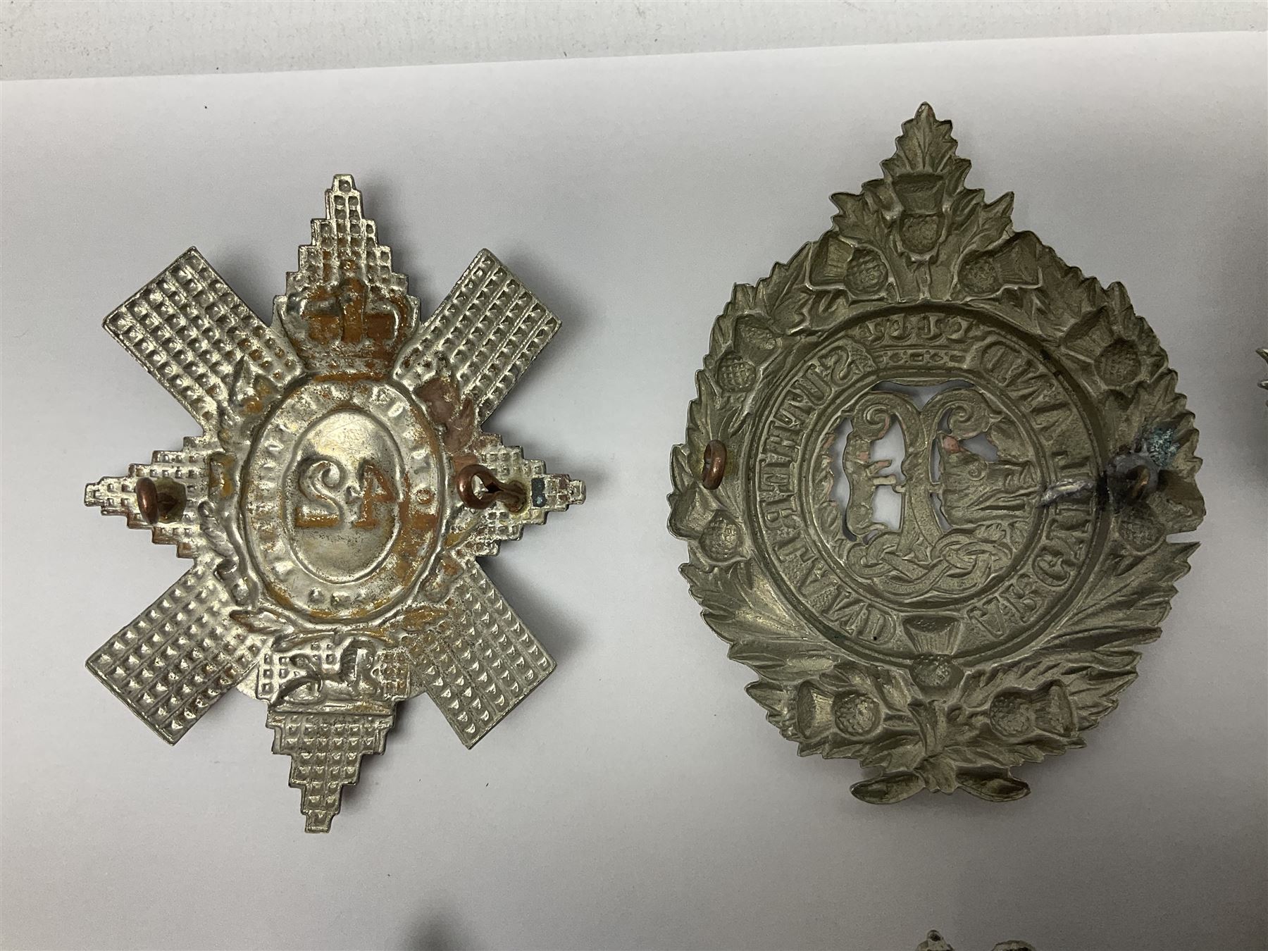 Thirteen Scottish metal Glengarry badges including Black Watch, Highland Regiment, Cameronians, Argyll & Sutherland, Seaforth Highlanders, Kings Scottish Own Borderers etc