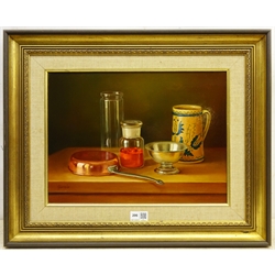 Andras Gombar (Hungarian 1946-): Still Life of Glass and Metalware, oil on board signed 29cm x 39cm