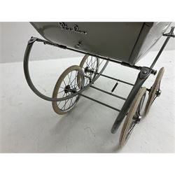 Silver Cross coach-built doll's pram with green fold-down hood and cover, sprung tubular frame, chrome and white handle, four spoked wheels with brake, mattress, pillow and bedding L97cm