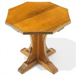 Mouseman - 1950s oak coffee table, octagonal adzed top on cruciform base and sledge feet, carved with mouse signature, dated 1956 and engraved 'Sylvia' to the top edge, by Ken Almack of the workshop of Robert Thompson, Kilburn

Notes:
Made by Ken Almack at the Robert Thompson workshop, Kilburn, where he trained and worked as a Mouseman craftsman; brother of Colin ‘Beaverman’ Almack, who later established his own workshop. The table was made for Sylvia to mark their engagement in 1956, prior to their marriage in 1957.

Provenance: The estate of Ken Almack; Tennants Auctioneers, 20th Century Design, 5 October 2024.