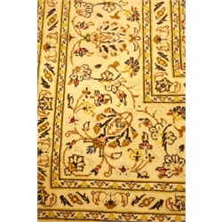  Persian ivory ground Kashan rug, star and flower field and border, 298cm x 210cm  