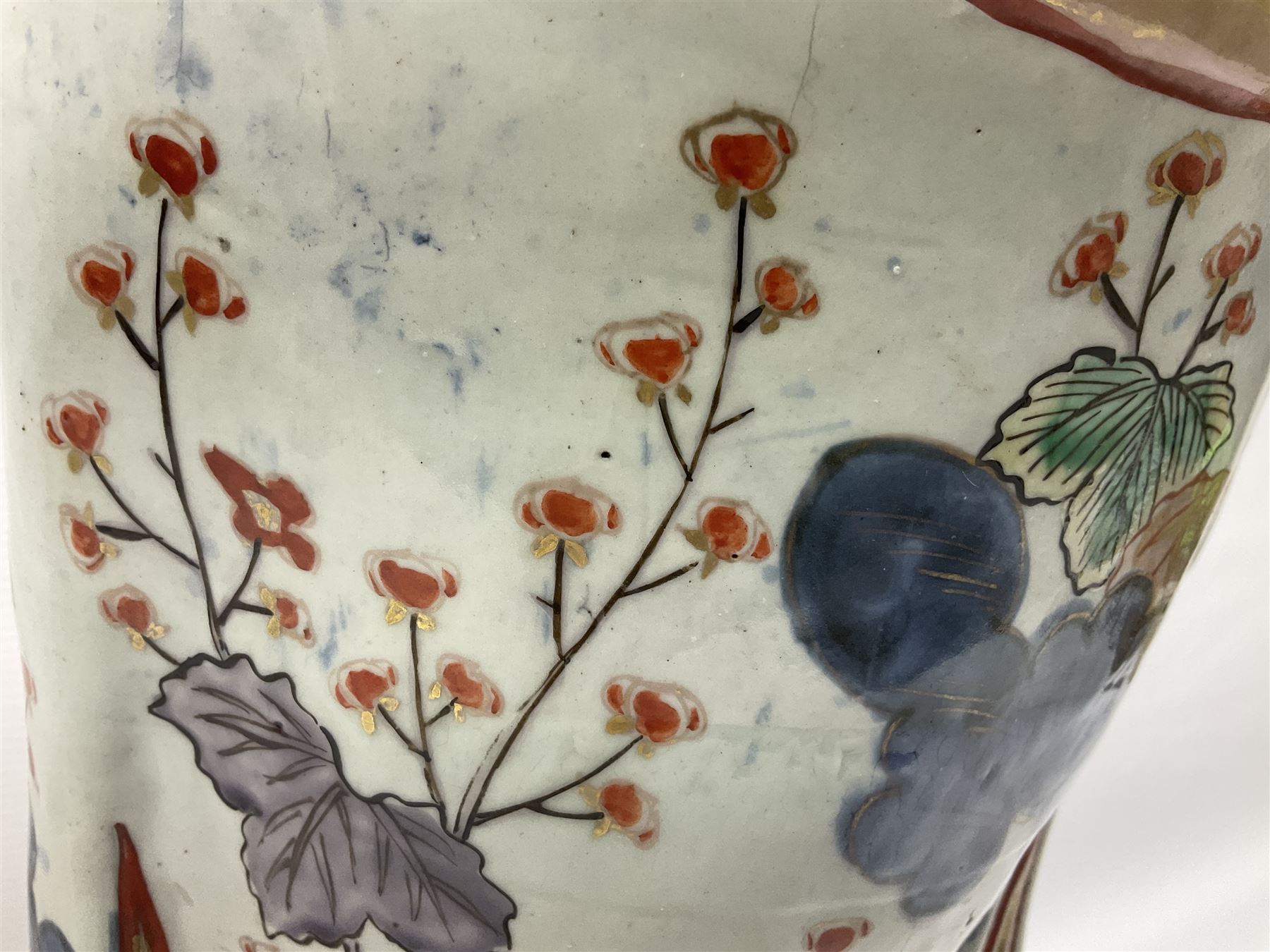 Large Japanese Imari porcelain figure, modelled as a Bijin, wearing a long kimono decorated with apple blossom and leafy branches on a white ground, with gilt detailing, possibly Edo period, H63cm