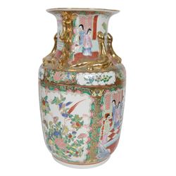 Pair of Japaneses imari vases, the central panel, decorated with figures in a landscape, together with famille rose vase, largest H37cm  