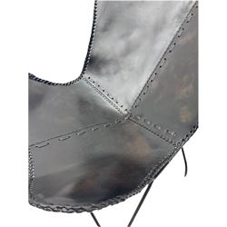 Metal framed butterfly chair upholstered in slung dark tan stitched leather 