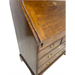 Georgian red walnut and mahogany bureau, moulded rectangular fall front with rounded upper corners, the interior fitted with sliding storage well, a combination of small drawers and pigeons holes, two short and two long drawers below, on bracket feet