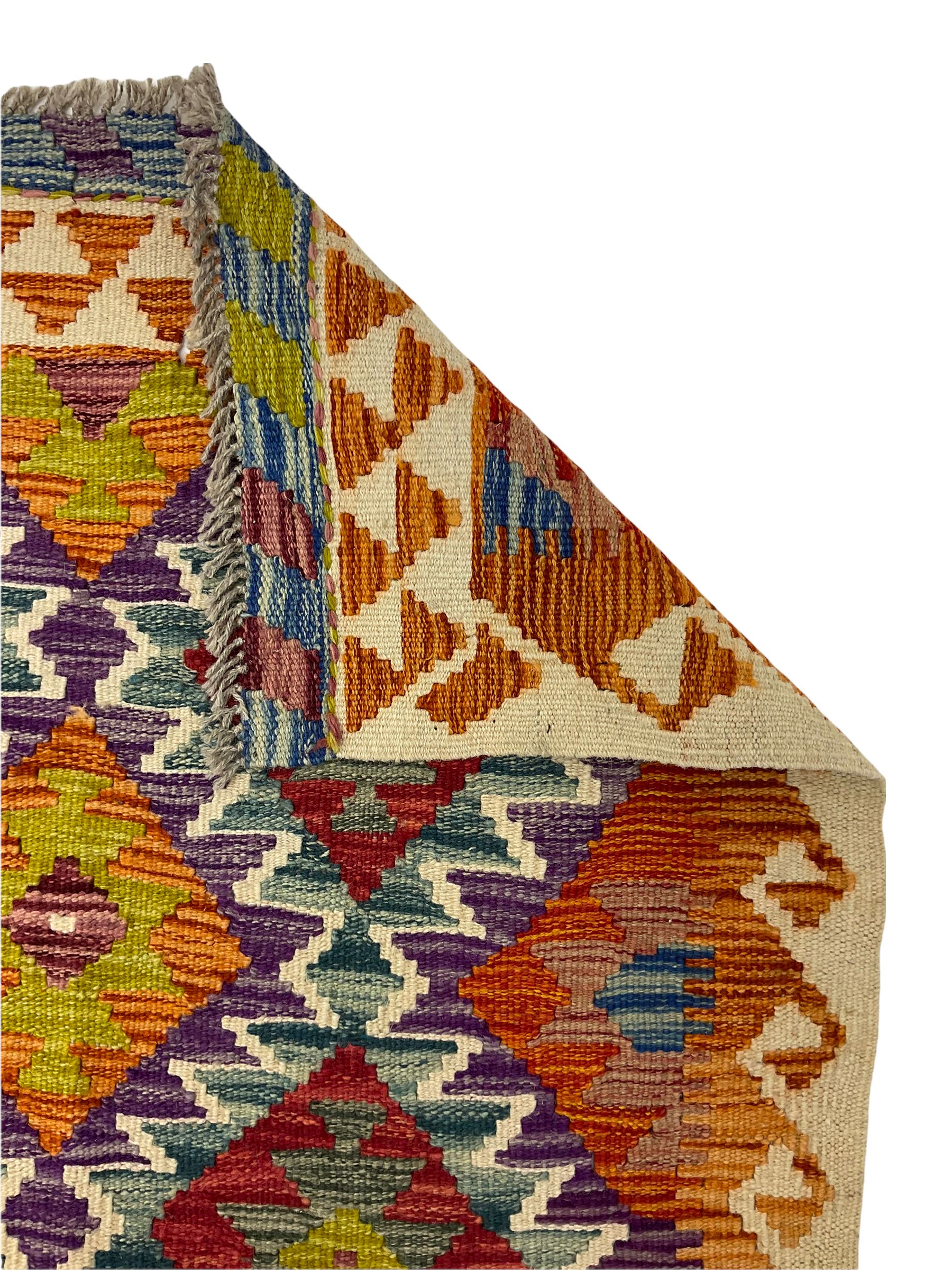 Chobi kilm runner, multi-colour ground, repeating stepped lozenge design
