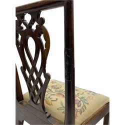 George III walnut side chair, foliate carved pierced and lattice splat decorated with flower heads and scrolls, moulded framed, the drop-in seat upholstered in floral needlework, on square moulded supports joined by H-stretchers