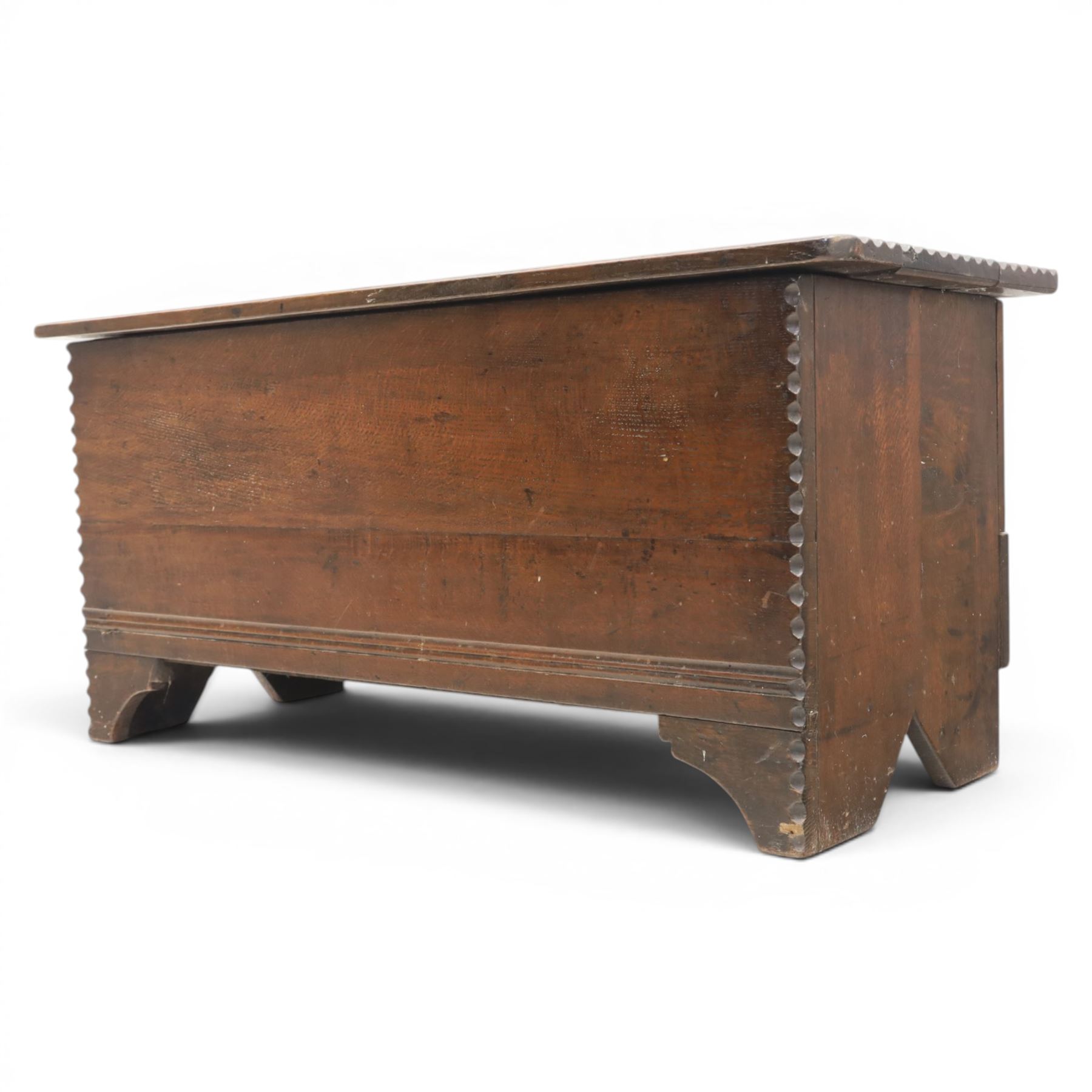 19th century oak boarded blanket box, with chip-carved edges, raised on shaped cut away bracket supports