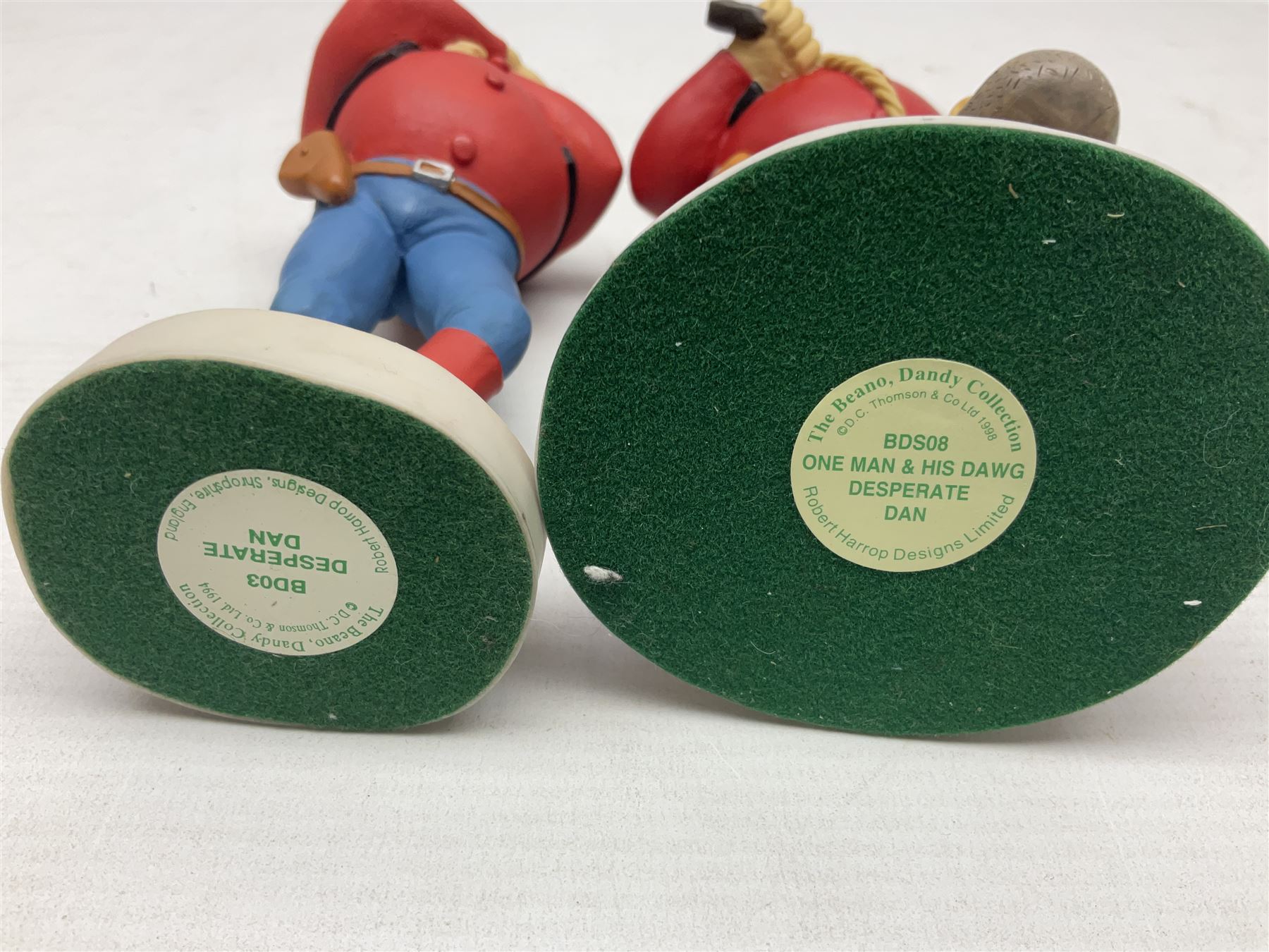 Eleven Robert Harrop figures from the Beano Dandy collection, comprising One Man & His Dawg BDS08, Picnic Desperate Dan BDS04, Fatty BD07, Desperate Dan BD03, Roger the Dodger BD20, Dennis the Menace BD01, Beryl the Peril BD05, Minnie the Minx BD04, Surfing BP03, two Spotty BD16, together with a Genuine Beano Ware lidded box (12)