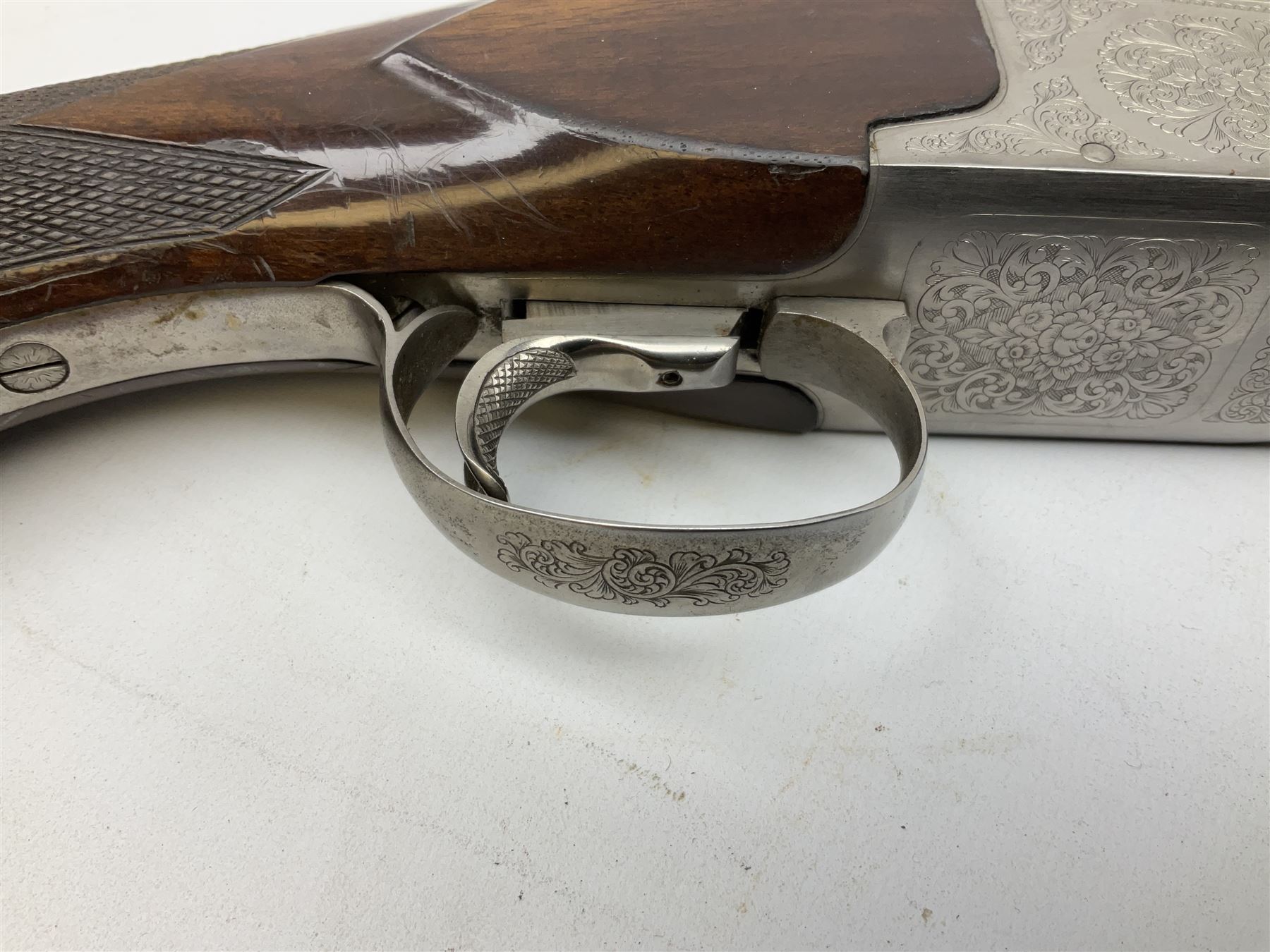 Winchester Japan 5500 12-bore by two-and-three quarters over-and-under double barrel boxlock ejector sporting gun, with 71cm barrels, ventilated rib and barrels, the walnut stock with chequered pistol grip and fore-end, single selective trigger and top safety, serial no.K542927E, L115cm overall; in gun sling SHOTGUN CERTIFICATE REQUIRED