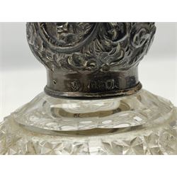 Octagonal and hobnail cut glass scent bottle of spherical form, with stopper and silver cover, hallmarked London 1912, together with a cut glass sugar sifter with silver cover, hallmarked Birmingham 1906, (2)