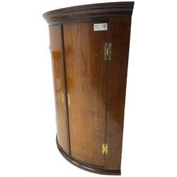 George III oak and mahogany wall hanging cylinder corner cupboard, moulded cavetto cornice over double cupboard enclosing three shelves