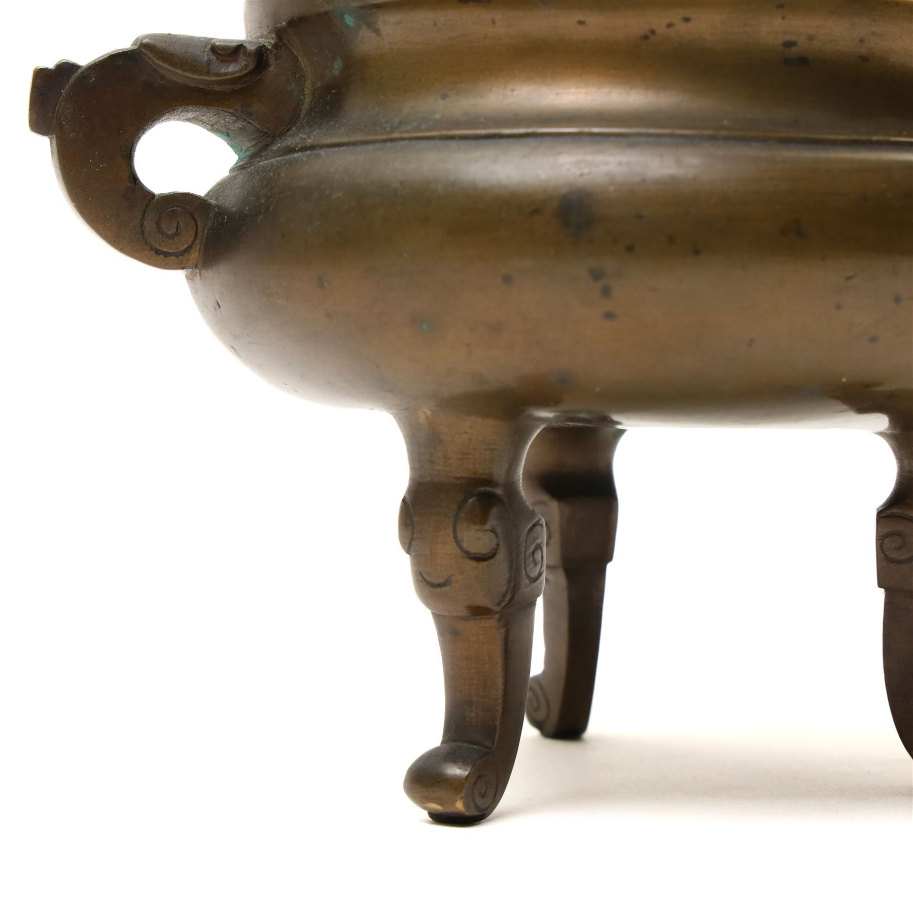 19th century Chinese bronze censer with loop handles and on shaped supports D13cm and an Asian bronze bell H17cm