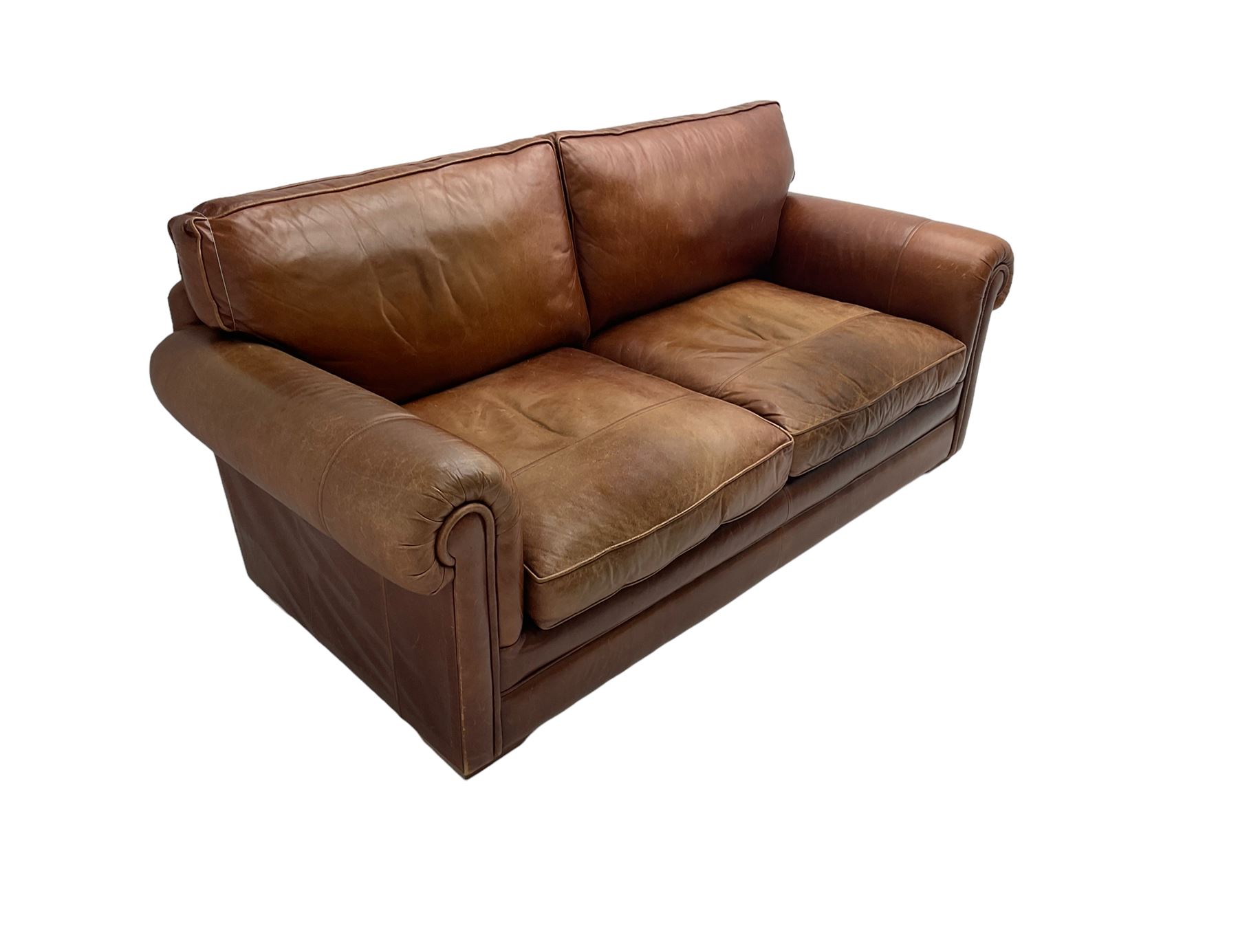 Large two seat sofa upholstered in tan 'Derwent' leather (W200cm D100cm H85cm), and matching armchair (W95cm)