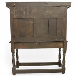 19th century and later carved oak court cupboard, the upper section with two drawers above a central cupboard door flanked by panels, lower section with single long drawer, on turned supports united by carved stretchers