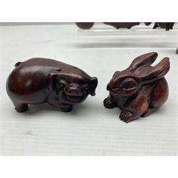 Seven carved netsukes, to include koi carp, pig, rat, rabbit etc