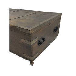 Early 19th century oak low blanket chest, metal strapped and bound, two carrying handles to either end, on castors