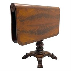 Unusual William IV mahogany Sutherland table, figured and book-matched rectangular drop-leaf top on cylindrical barrel movement, turned roundels to each end, on turned pedestal with acanthus carved baluster, shaped platform with four extended paw feet