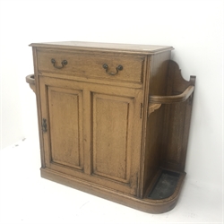 Early 20th century oak hallstand, single drawer above cupboard and stick stand, shaped plinth base, W109cm, H92cm, D44cm