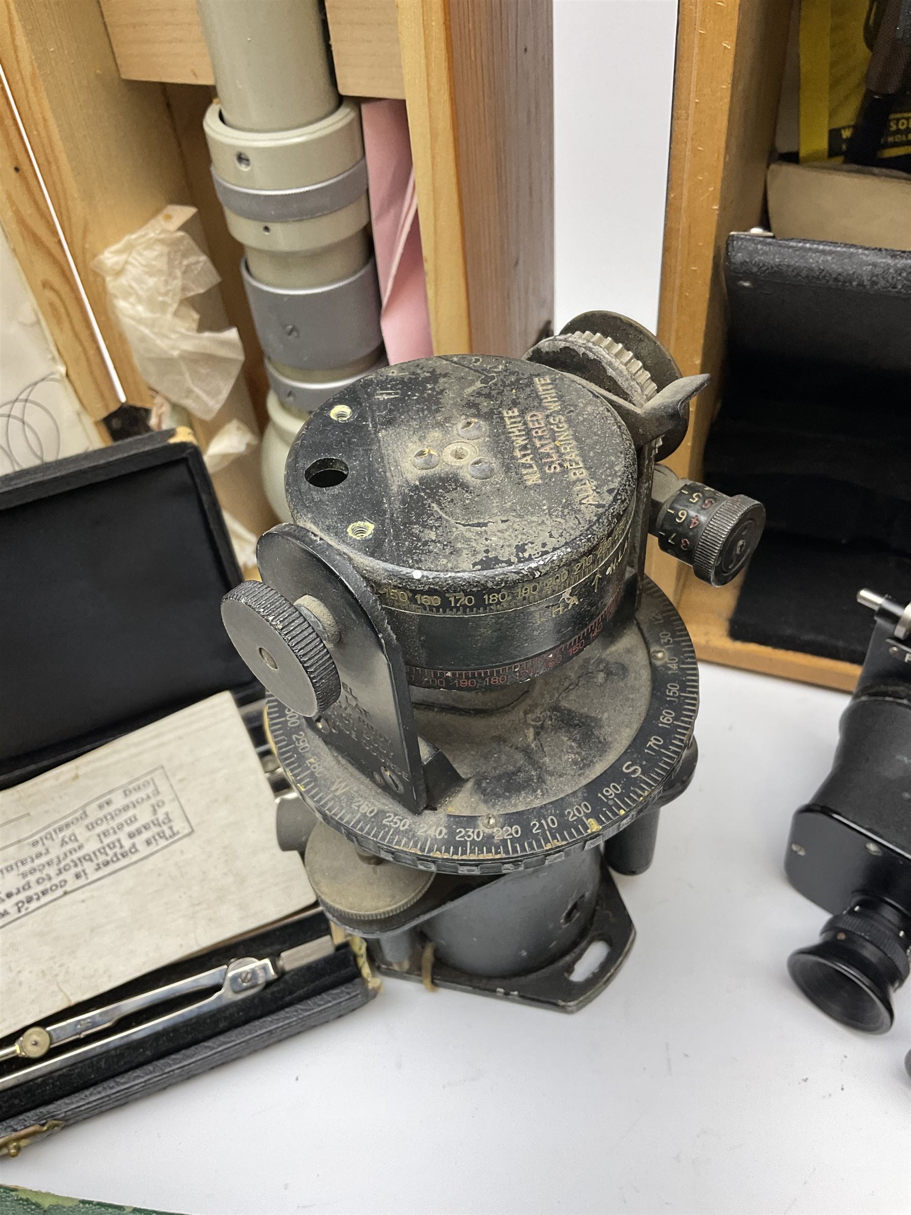 WW2 American Fairchild F-71 binocular magnifying telescope, in green painted wooden carrying box with instruction leaflet L48cm; WW2 Air Ministry Astro Compass Mk.II Ref. 6A/1174(0); Zenith Projection & Camera Lucida Attachment RA-6, boxed with instructions and 1977 purchase invoice; two cased sets of drawing instruments; and a boxed Faber slide rule (6)