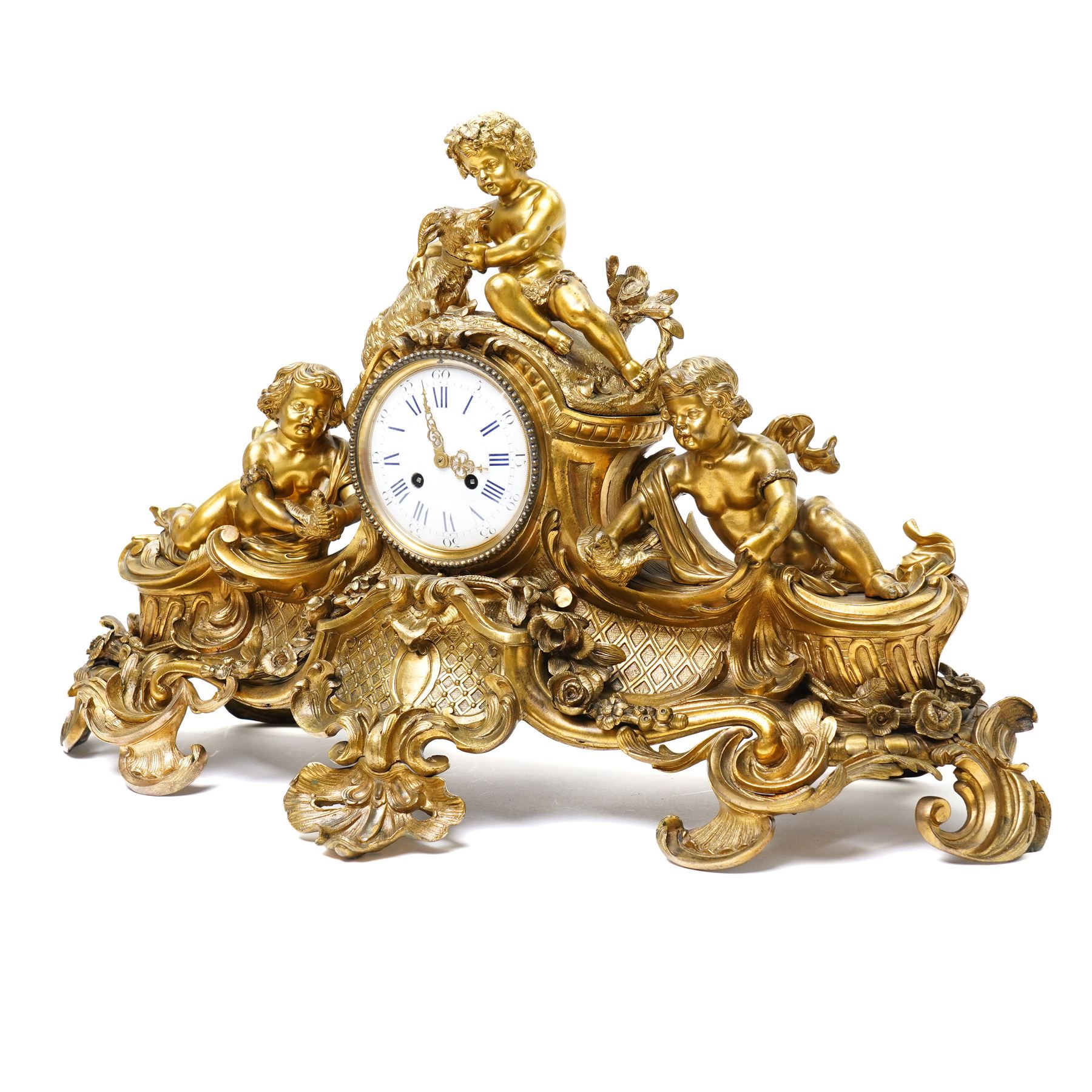French-large late 19th-century 8-day Louis XV style gilt bronze mantel clock, with a cast rococo style case, elaborate C-scrolls, shells, and floral sprays, surmounted by a seated putto and goat symbolising pastoral love, flanked by two further seated putti on a scrolled foliate base, 5