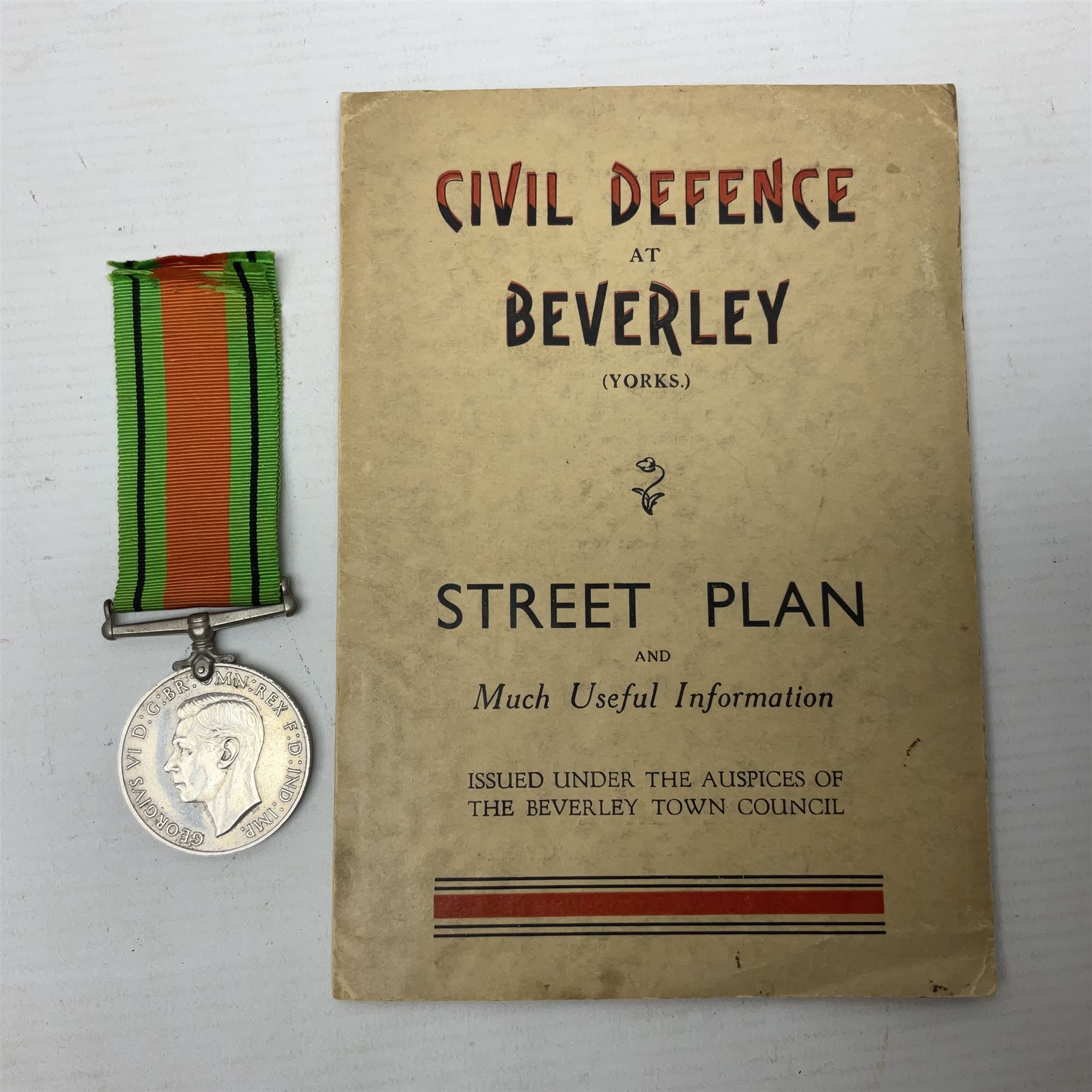 WWII Home Guard Service certificate to Albert John Pullinger with WWII Defence Medal; fretworked wooden Home Guard picture frame, image size 19 x 24cm; and WWII Civil Defence at Beverley (Yorks.) folding street plan (4)