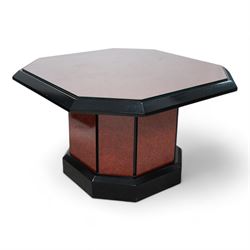 1980s figured wood finish and black lacquered coffee table, square canted top with chamfered edge, on canted pedestal with plinth base 