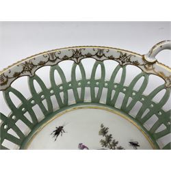 Pair of 19th century German openwork chestnut baskets, with twin handles and scrolling gilt border and star rim, painted to the centre with birds and insects, D22cm 