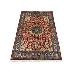 Small Persian Najafabad rug, red ground field decorated with central medallion surround by stylised flower and bird motifs, guarded floral design border 