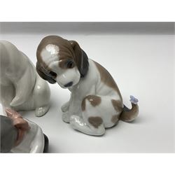 Five Lladro figures, comprising Cat and Mouse no. 5236, That Tickles no. 5888, Gentle Surprise no. 6210, Little Hunter no. 6212 and Resting Polar Bear no. 1208, largest H12cm