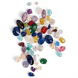 Collection of loose gemstones including amethyst, peridot, garnet, pearl, citrine, cubic z...
